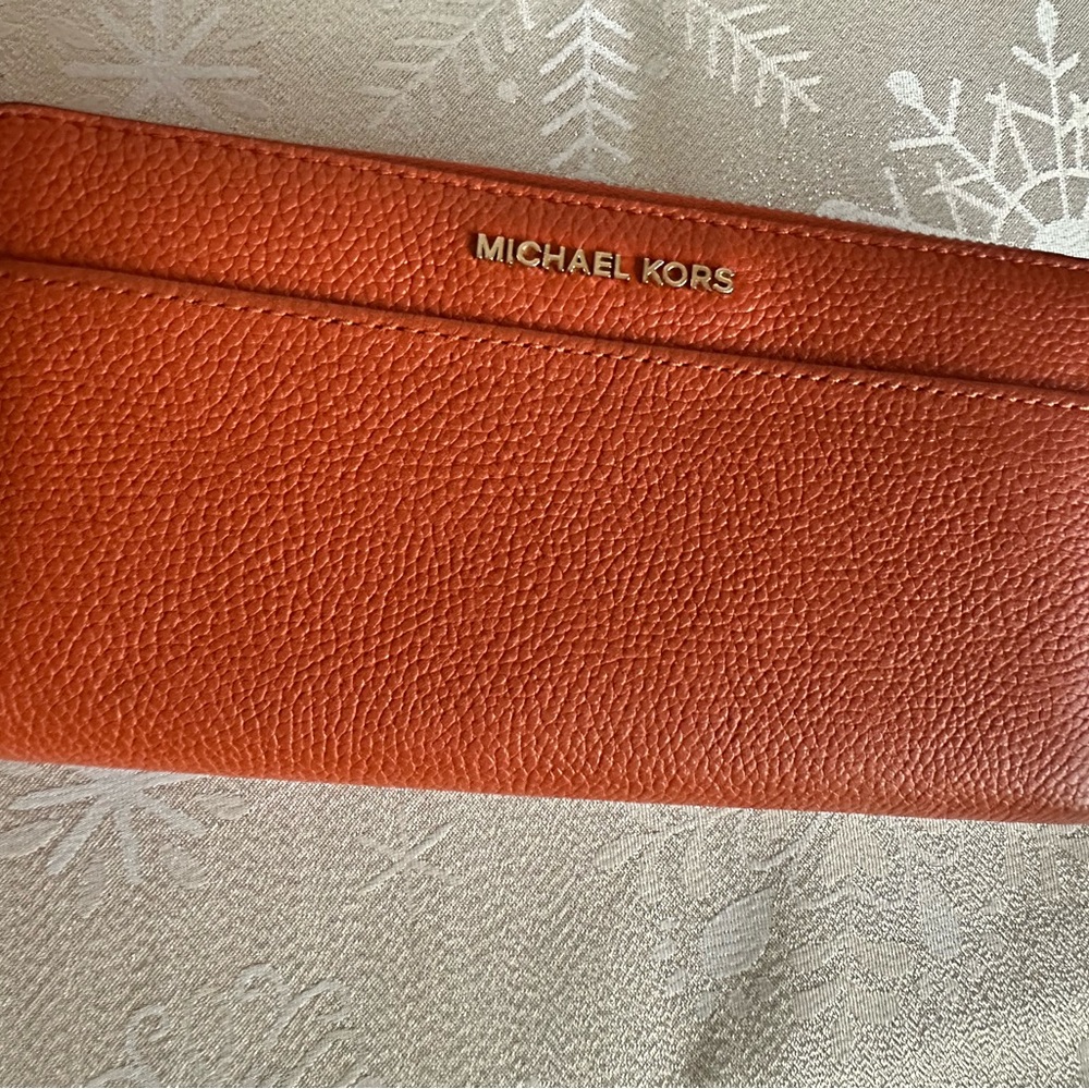 Gently used sturdy soft grained leather wallet with multiple compartments.
